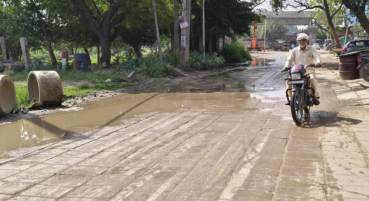 Water filled on the road due to sewer line overflow