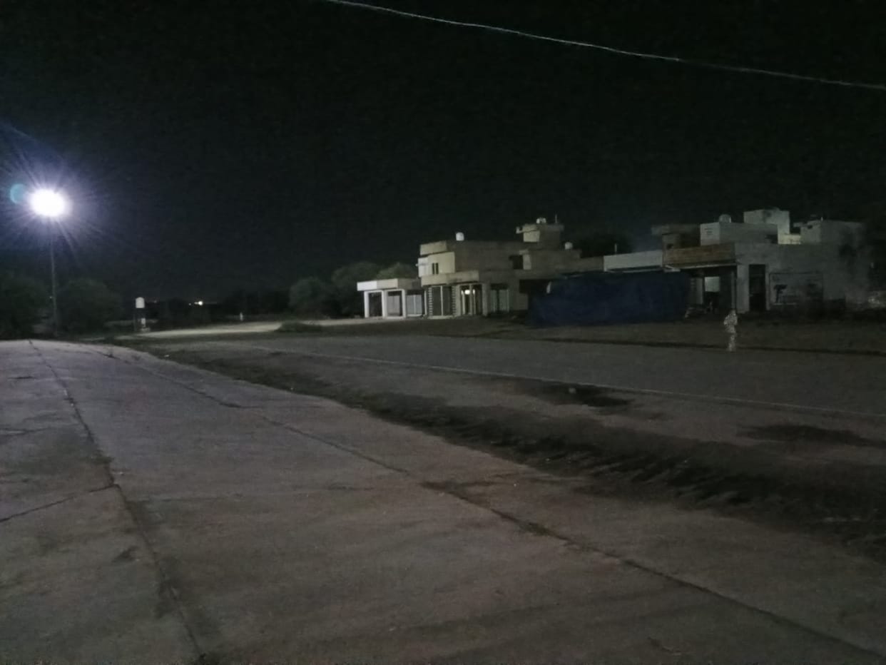 Silence descends upon the Narnaul New Grain Market as evening falls; farmers have stopped arriving.