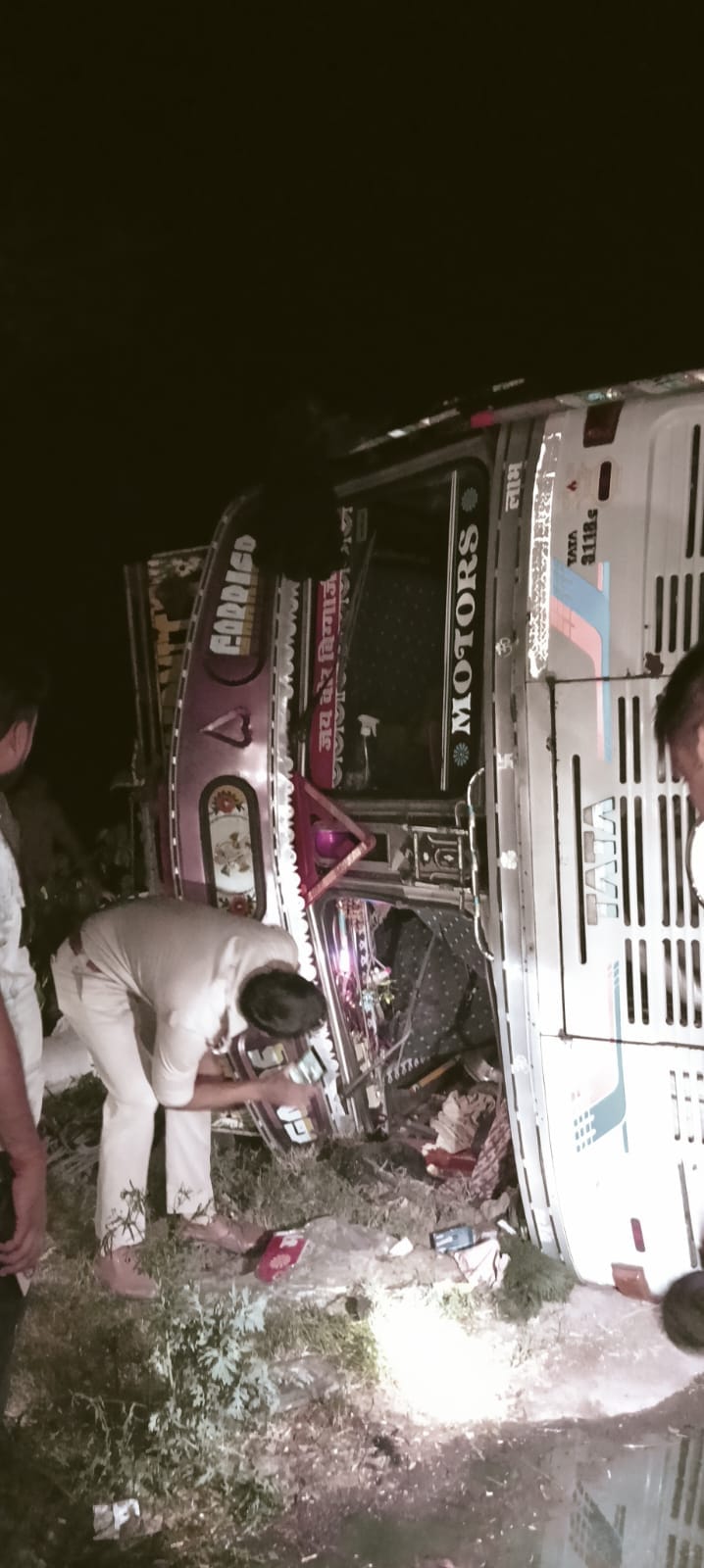 A truck loaded with goods overturned while trying to save a bike rider.