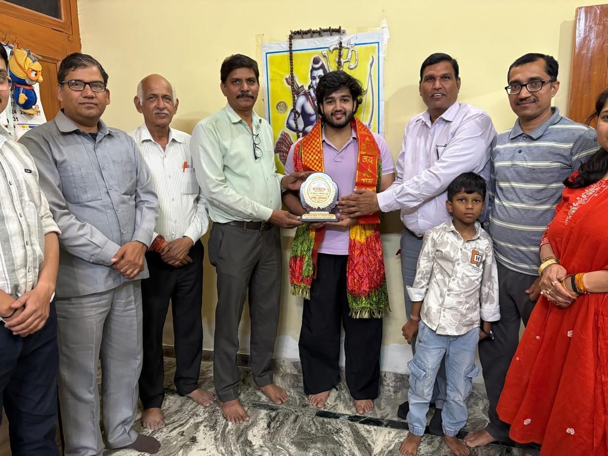 Tanishk, who became a Superintendent in the Income Tax Department, was honored.