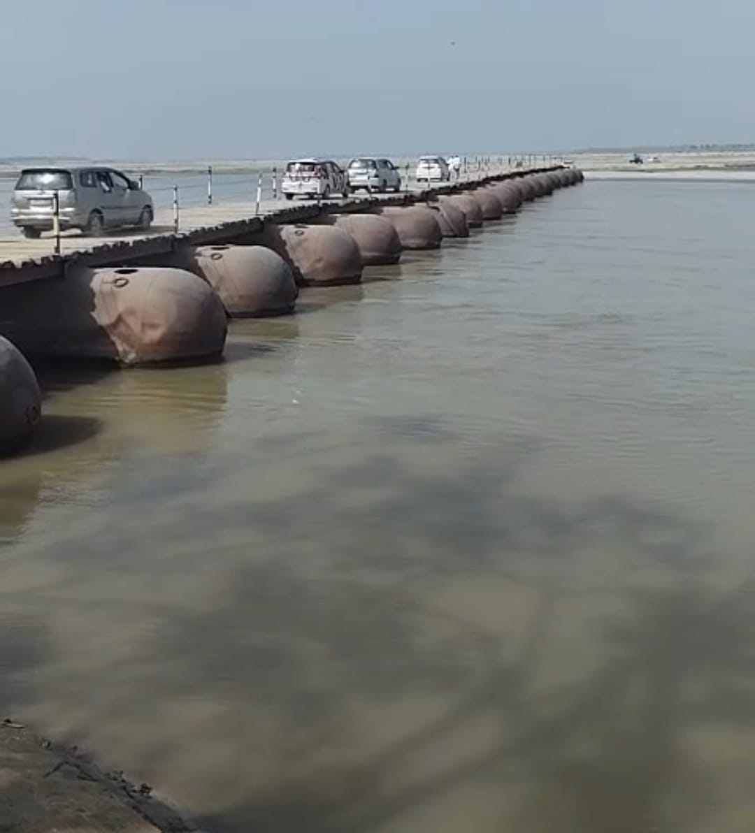 After the road is repaired, the movement of vehicles starts on the pontoon bridge.