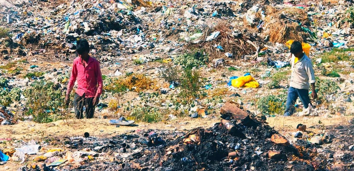 Municipal employees collecting garbage and spreading it around the city.