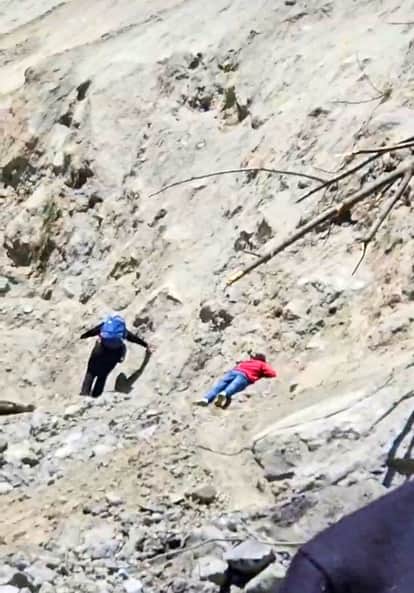 Road buried in debris...mountain standing like death in the way