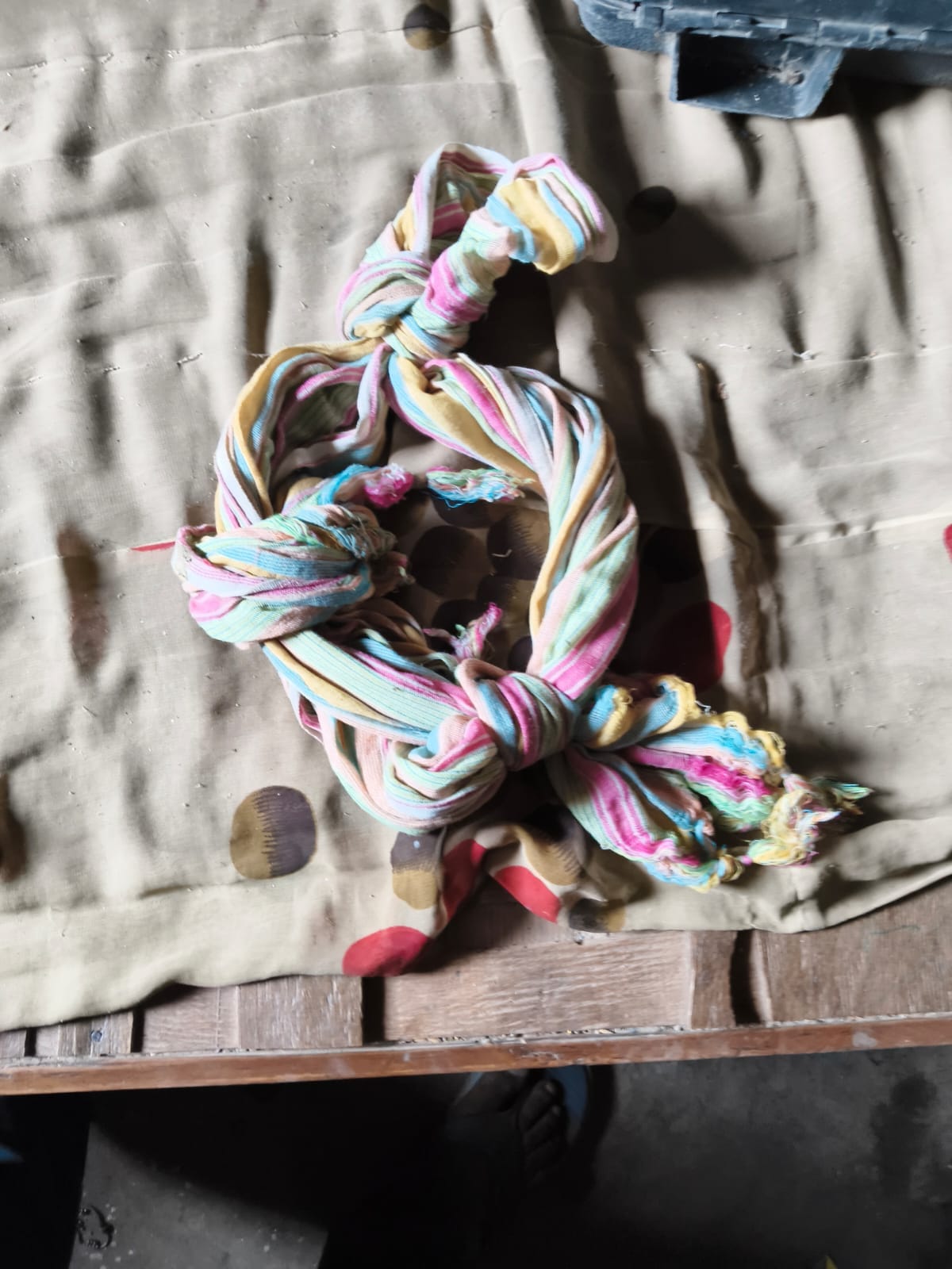 The boy died of suffocation; his scarf was found tied in a knot.