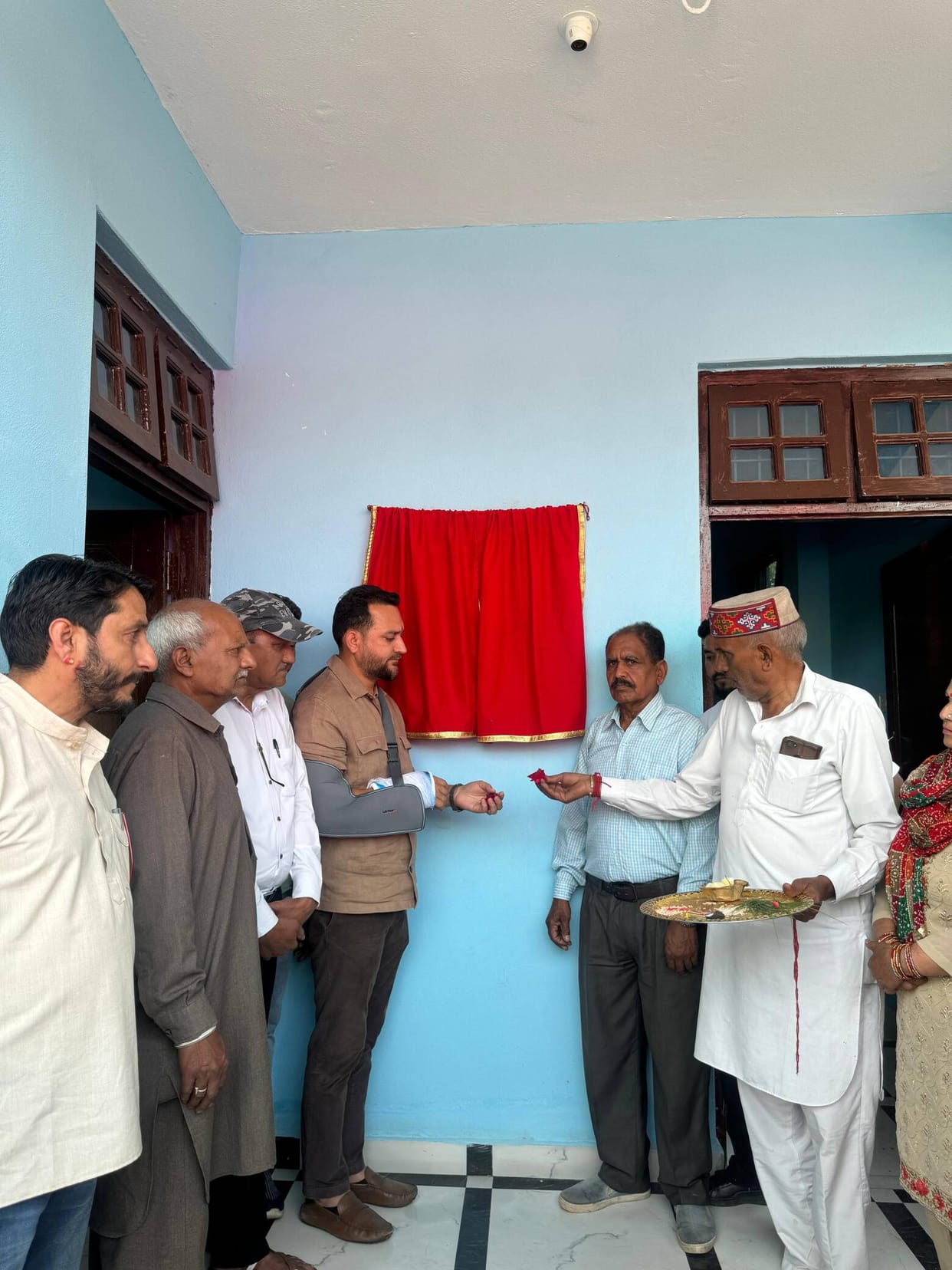 The MLA dedicated the bridge and the Mahila Mandal building.