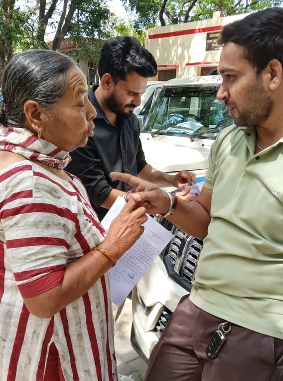 An elderly woman arrived at the tehsil with a flammable substance with the intention of self-immolation; the staff snatched the bottle.