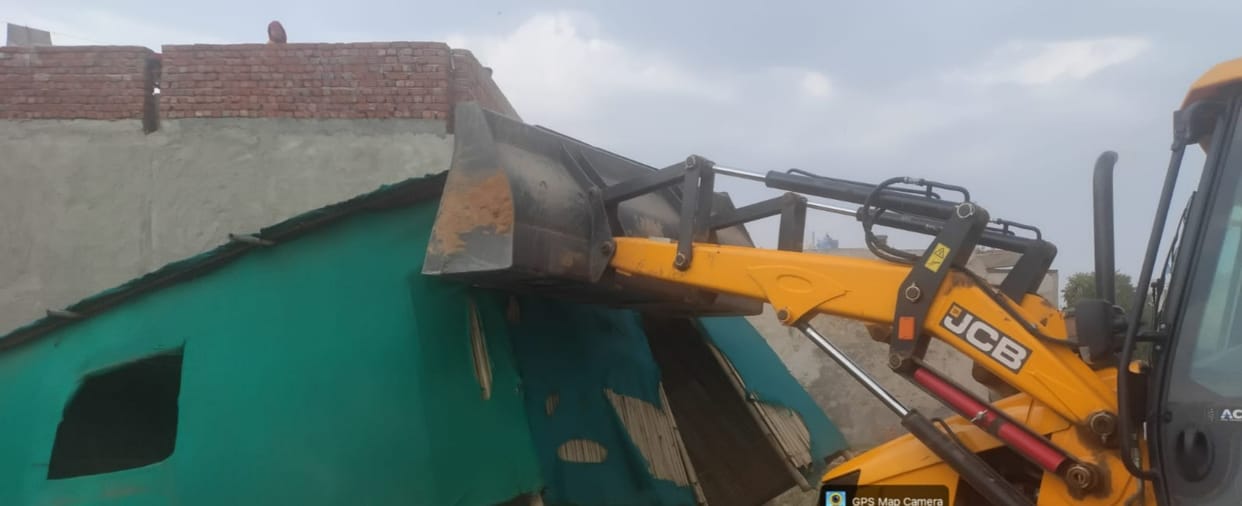 Bulldozer Demolishes Illegal Colony on Three Acres; 18 DPCs and Two Boundary Walls Razed