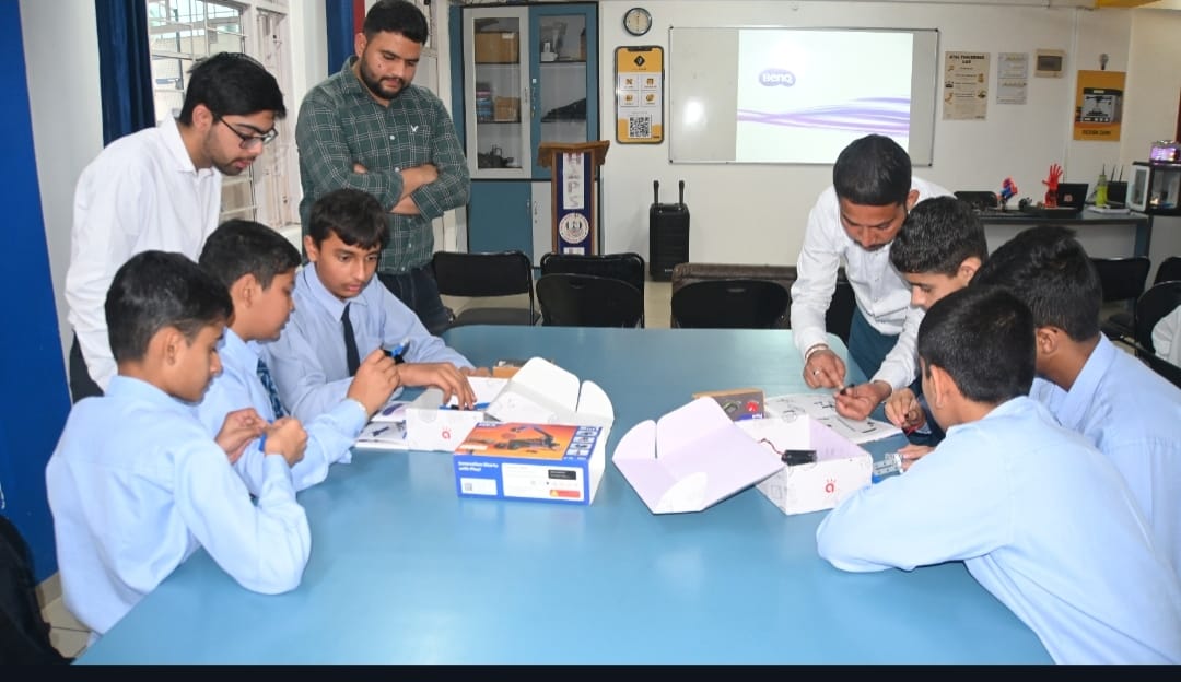 Students learn robotics at Him Academy