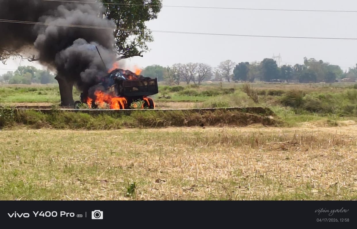 A tractor-trolley loaded with crops caught fire after colliding with an electric wire