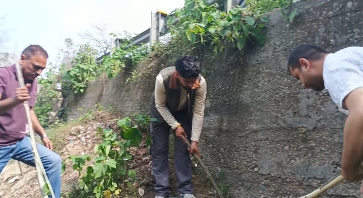 Cleaning around the bridge on the rail road