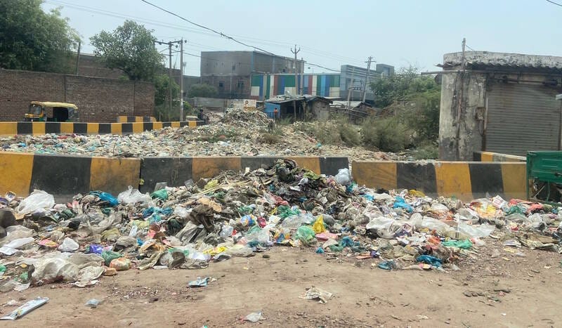 Heaps of garbage on the roadside in Rajiv Colony create problems