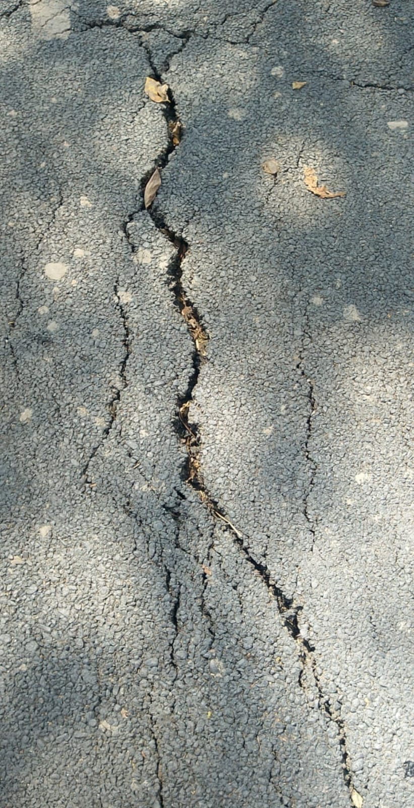 Cracks appear on the newly constructed dam road, villagers express anger