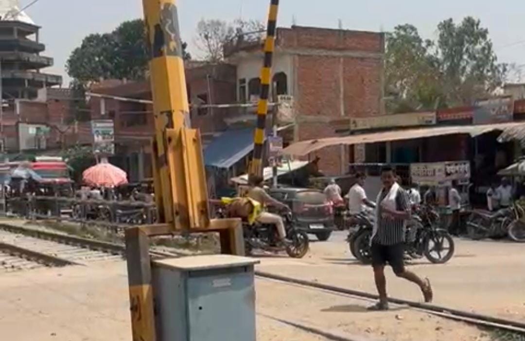 The railway crossing was open when the train arrived; the gateman was absent