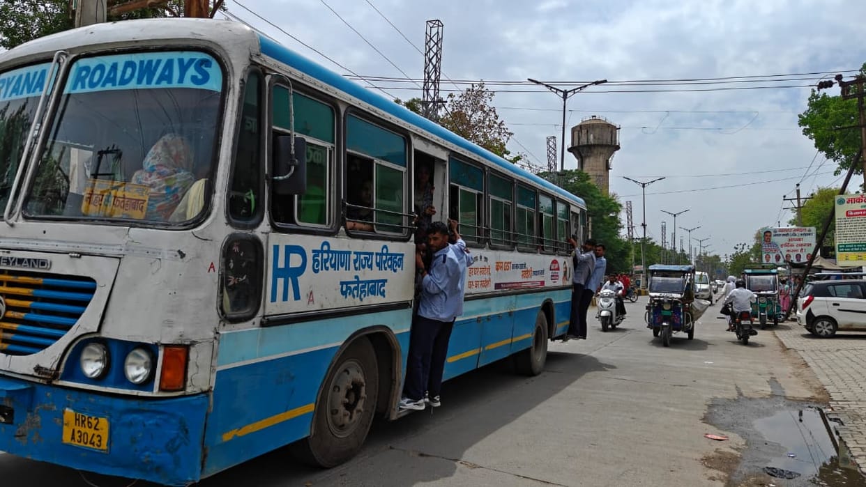 Due to lack of buses, students are forced to travel hanging