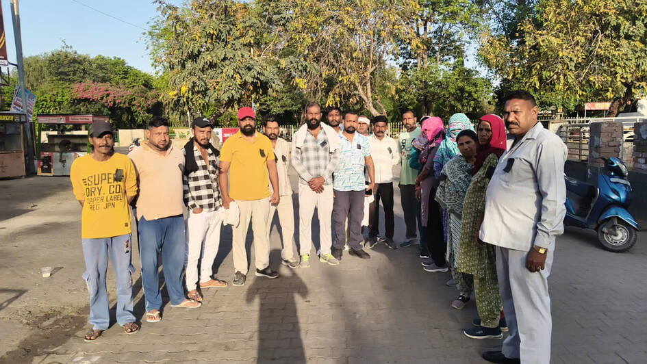 Municipal council employees expressed their anger by wearing black badges