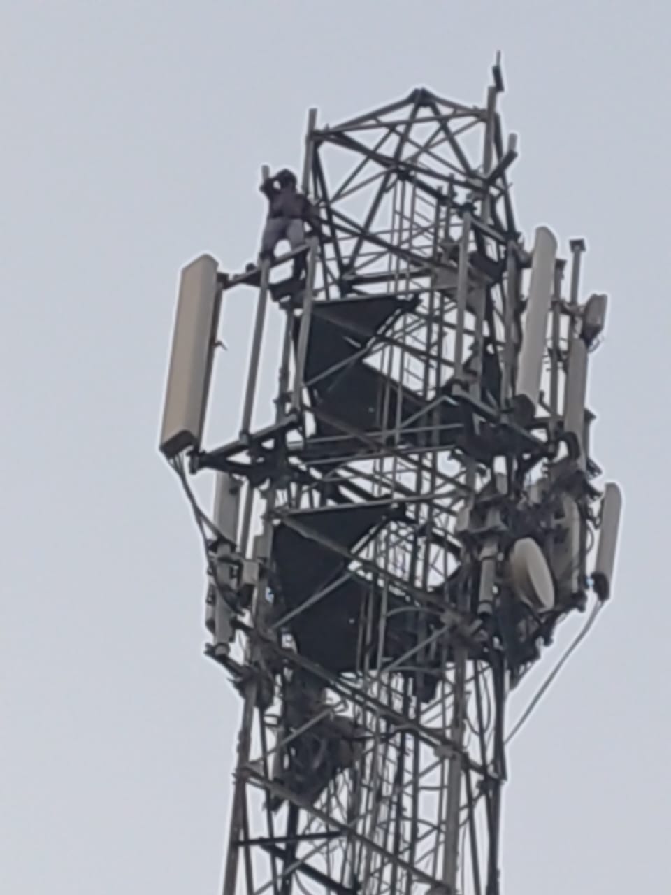 A young man climbed a tower after not seeing his wife at her in-laws' house.