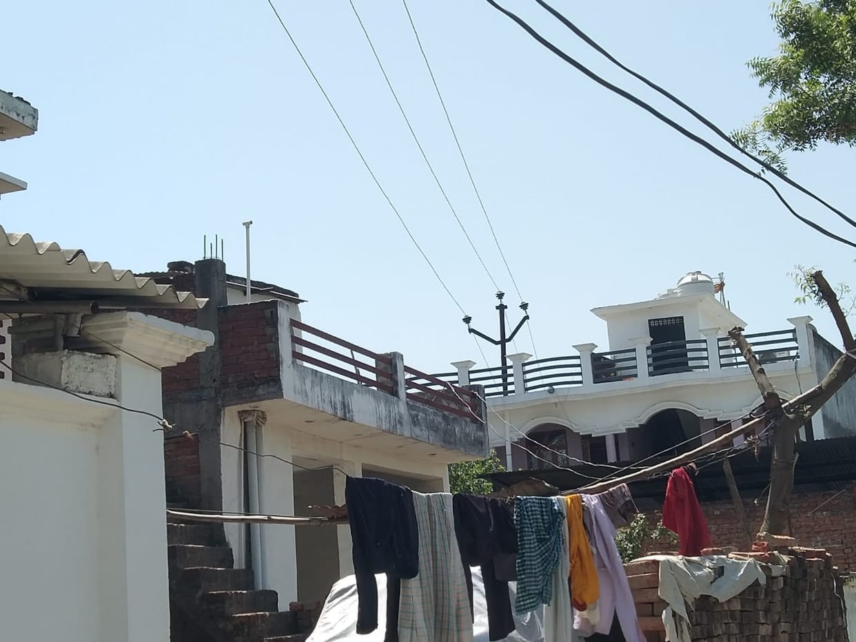 High tension lines passing over houses like death