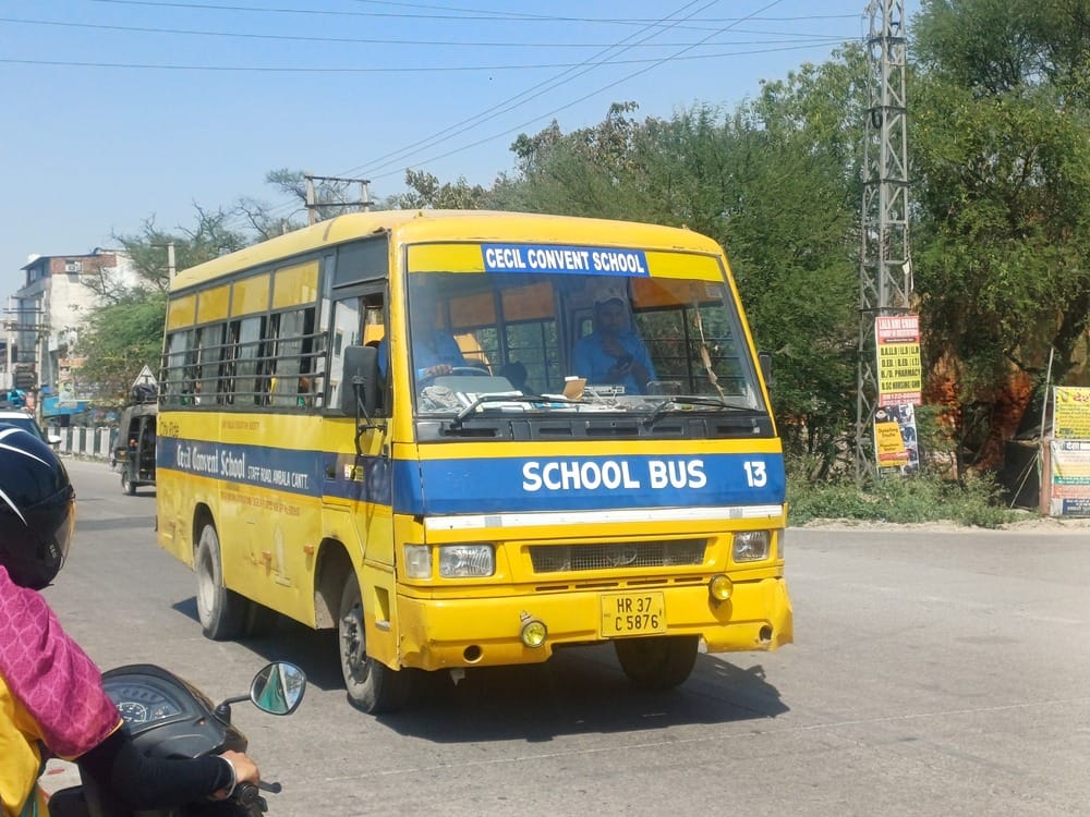 School buses parked on highways and main roads, risking accidents