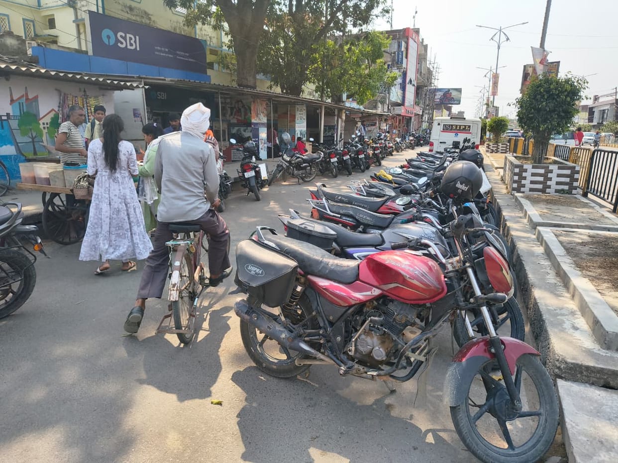 There is no parking arrangement in the city....the road is occupied by vehicles