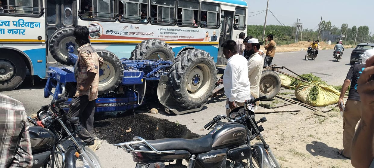 Tractor Overturns After Collision with Dumper; Driver Injured