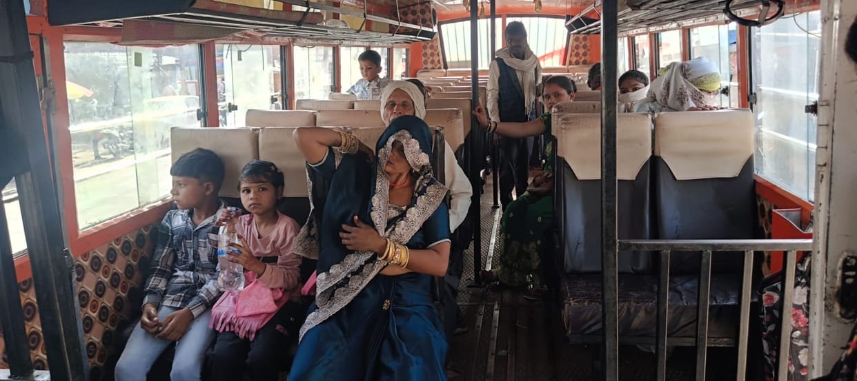 Passengers are suffering from the heat as the roadways bus is parked in the sun.
