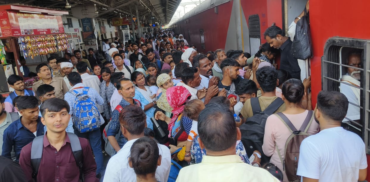 Crowds at the station, jostling for trains