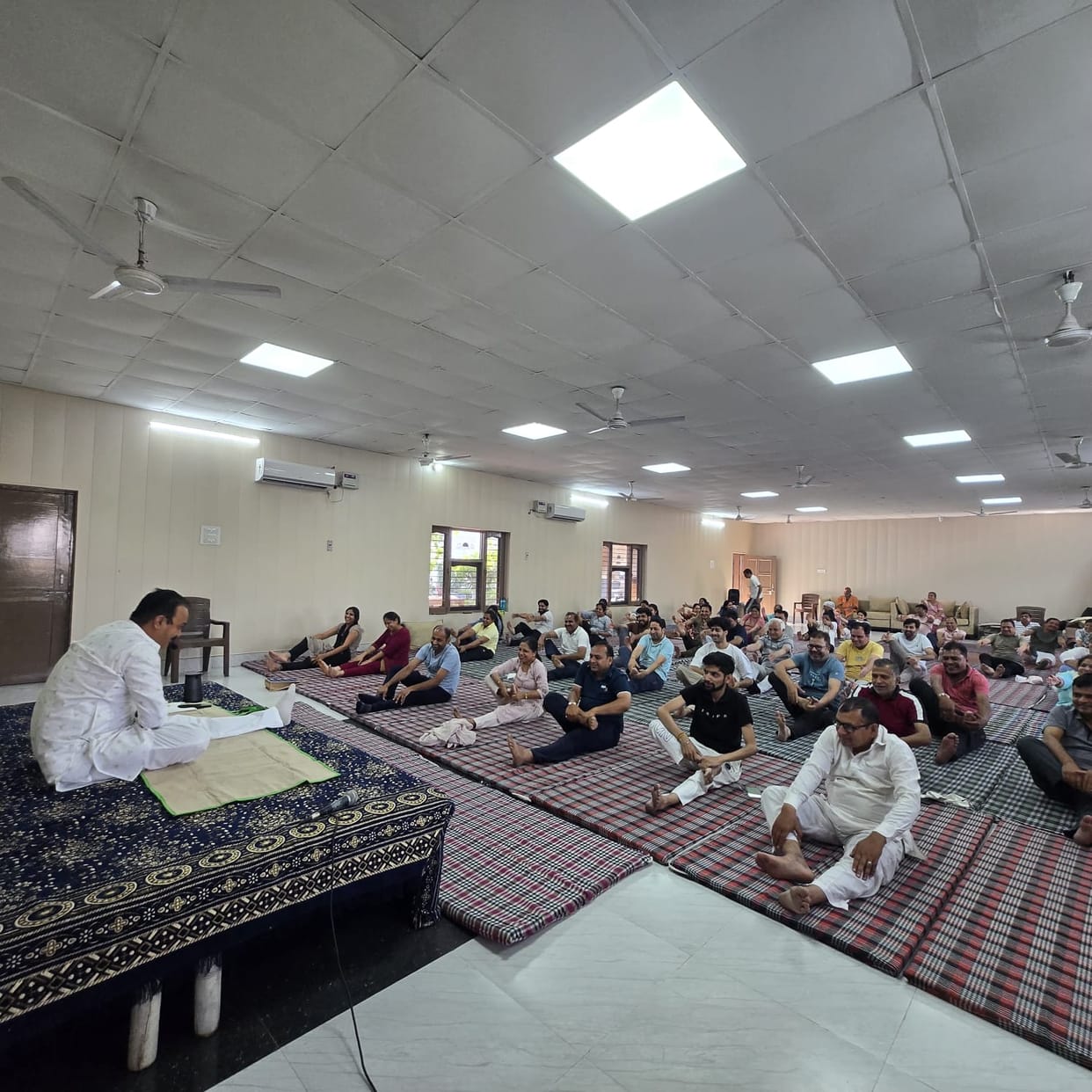 Sadhaks performed yoga in the Wake Up-Shake Up program.
