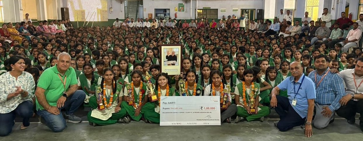 High school district topper Aarti and other meritorious girl students were awarded.