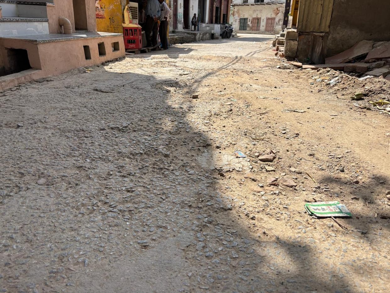 The road in Bateshwar's main market has been in a bad state for the past 10 years, leaving pedestrians in distress.