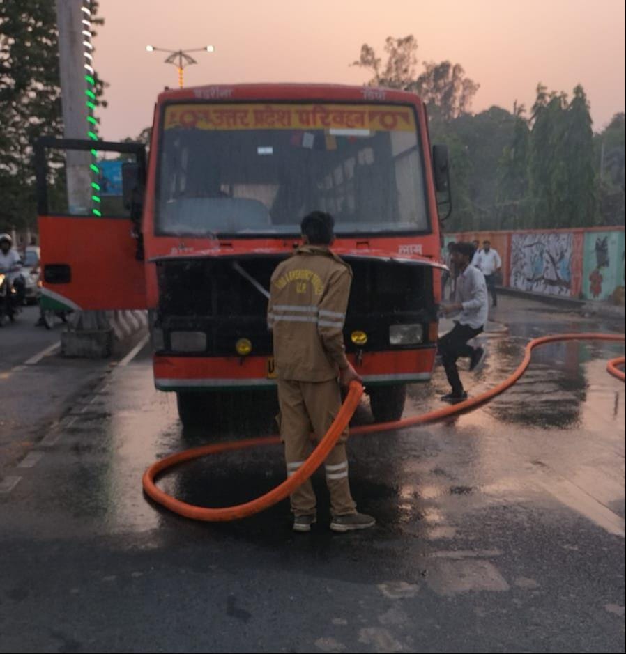 Smoke billows from moving roadways bus; chaos ensues.
