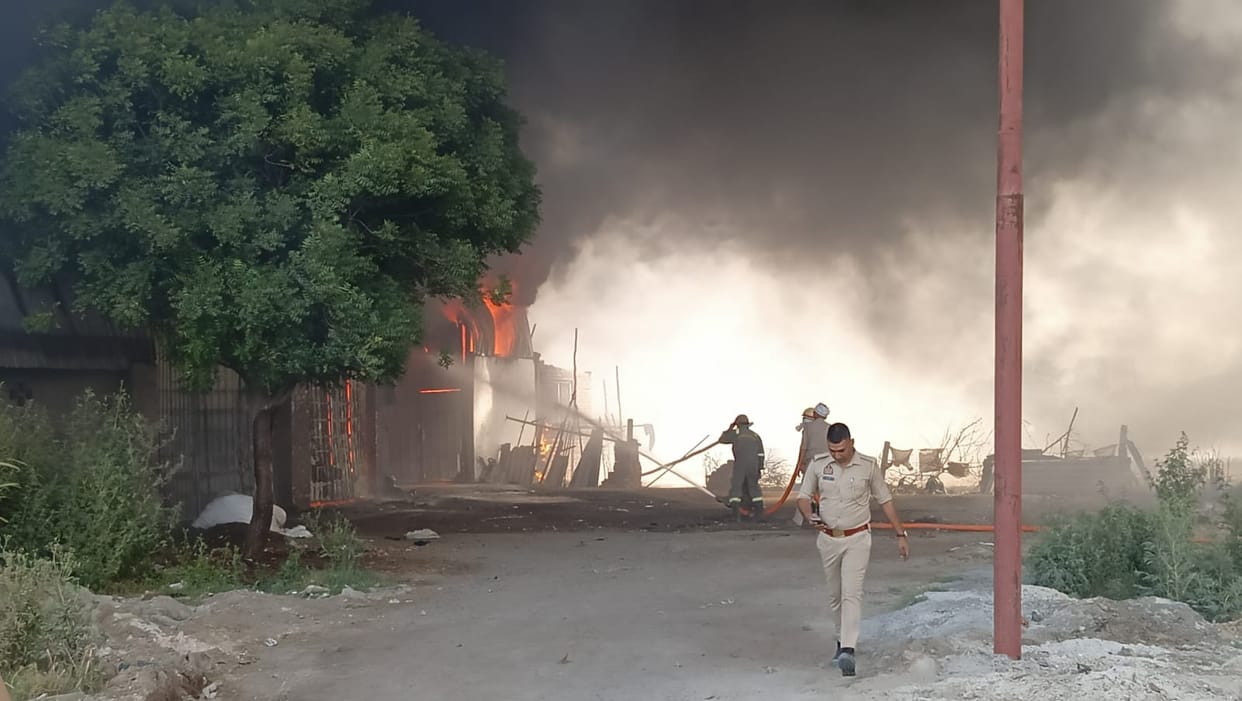 80 huts were gutted in a massive fire, with two transport companies and a jeans factory also affected.