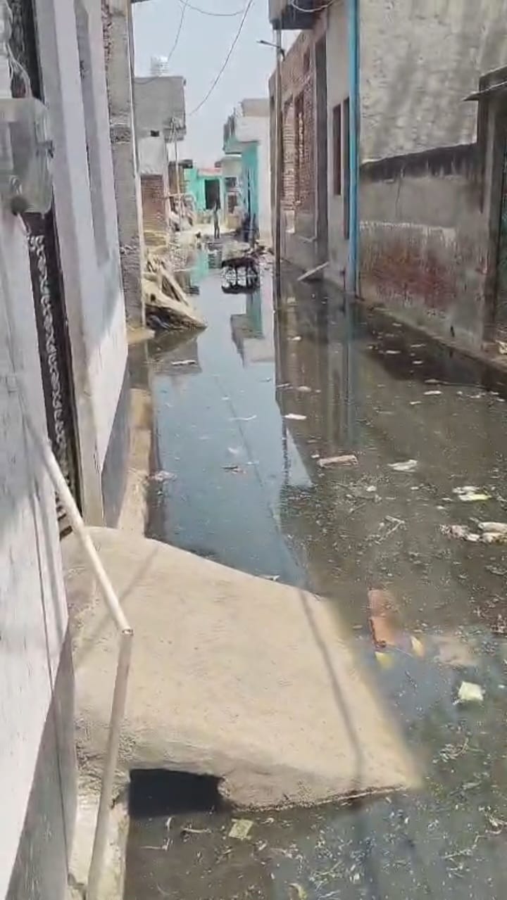 The dirty water of the overflow pond is troubling the people of the new colony.