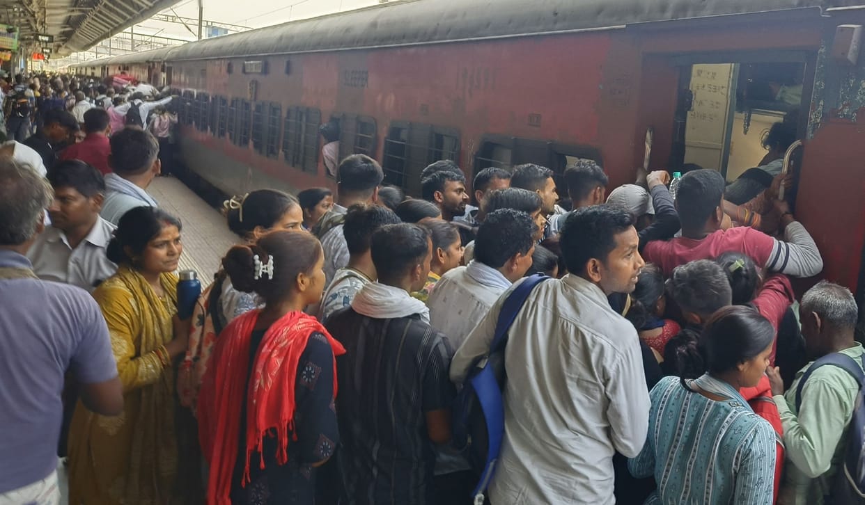 Due to the crowd, passengers were standing till the gate of the bogie.