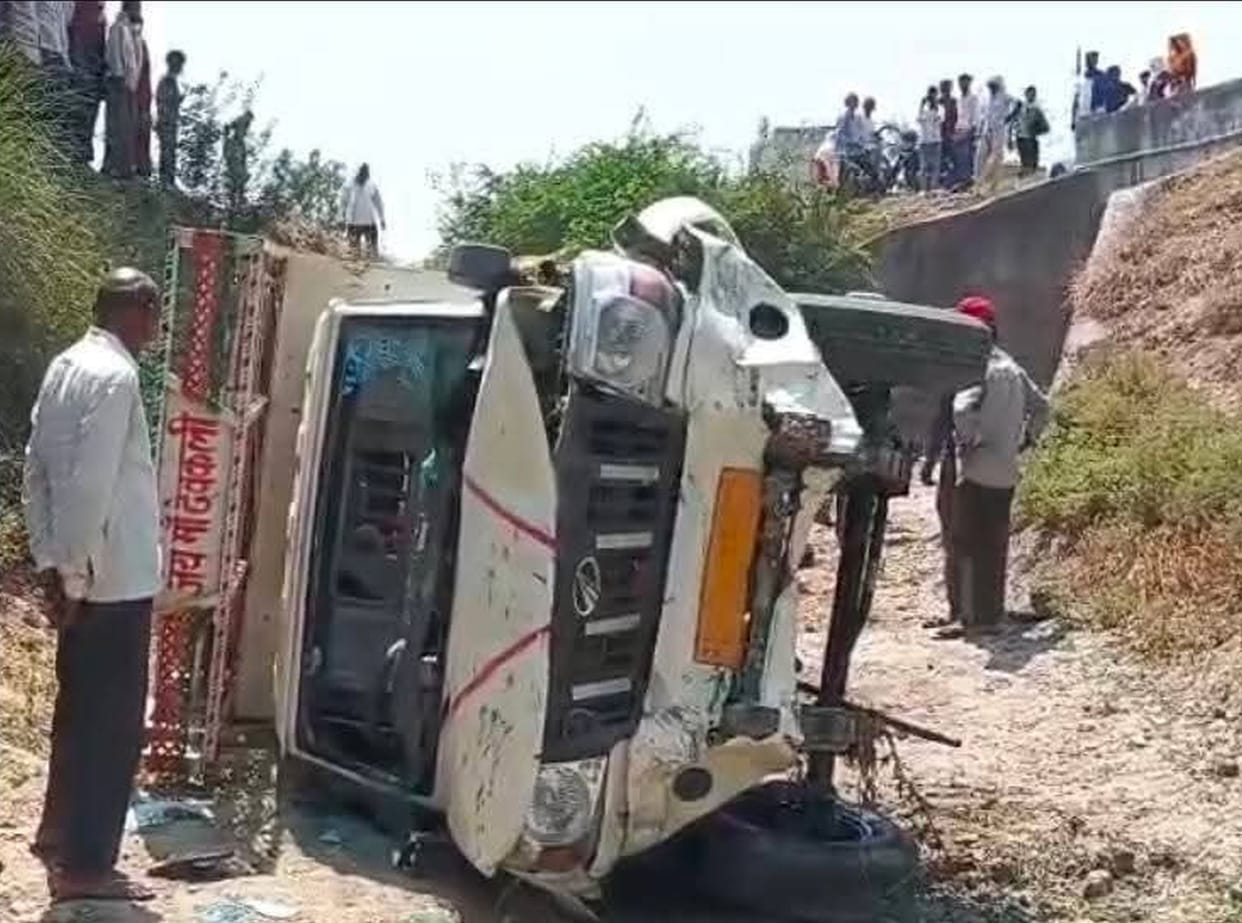 Pickup collided with bike and fell into ditch, 11 injured