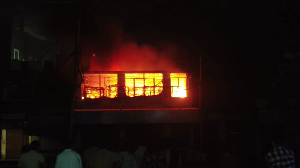 A massive fire engulfed a two-story grocery store in the main square, turning goods worth lakhs into ashes and the building into rubble.