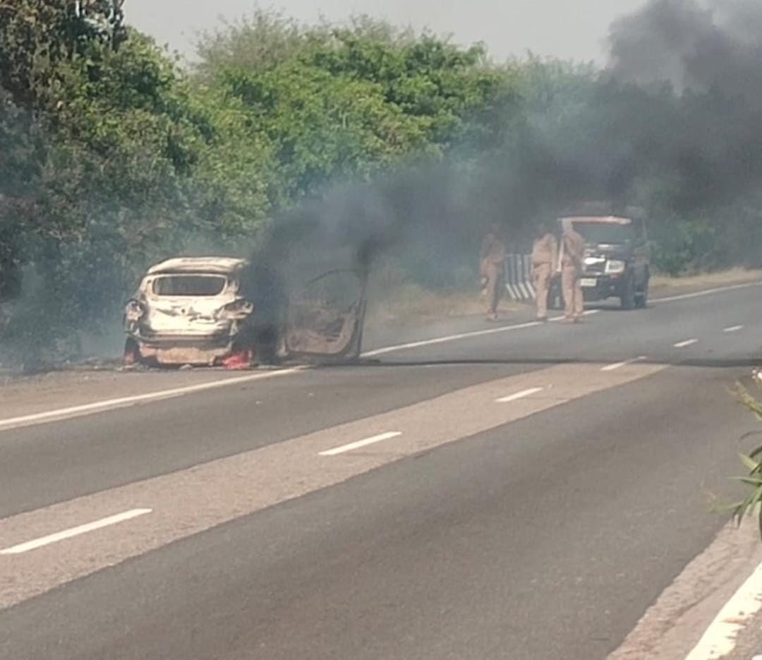 A car burst into flames as it ran on the highway, and the driver jumped out to save his life