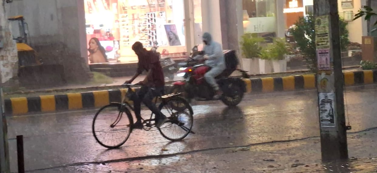 Rain Brings Relief; Mercury Drops 9.8 Degrees