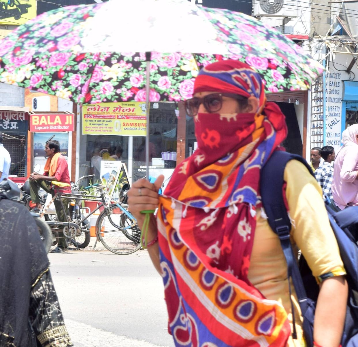 People kept wiping sweat throughout the day in the humid heat.