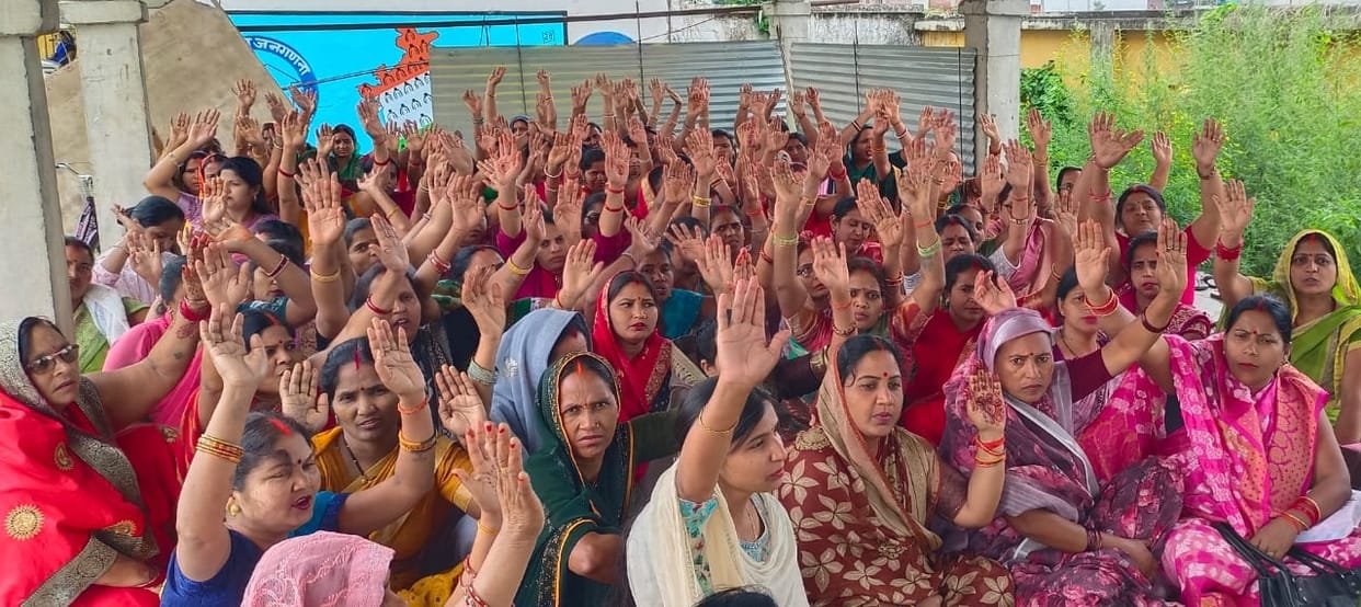 Anganwadi workers staged a sit-in protest against low honorarium.