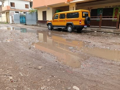 The road turns into a pond after a light rain.