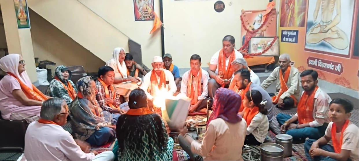 Offering oblations into the sacred fire, praying for peace