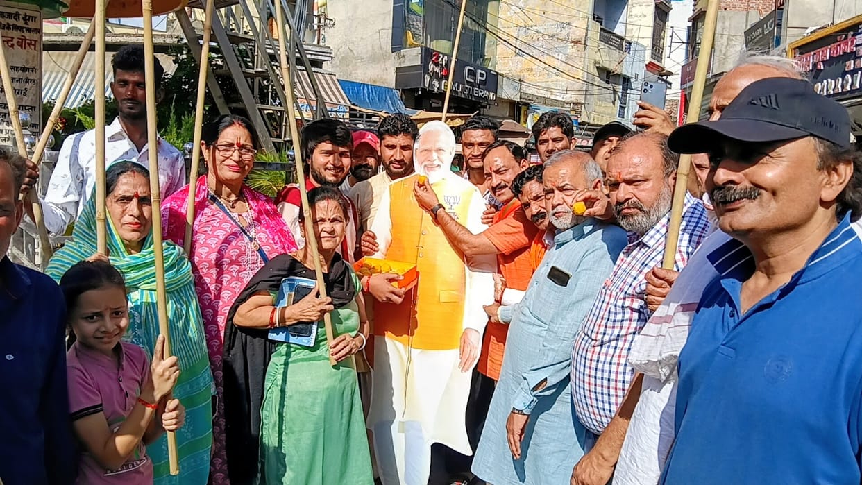 BJP workers celebrate victory, distribute sweets