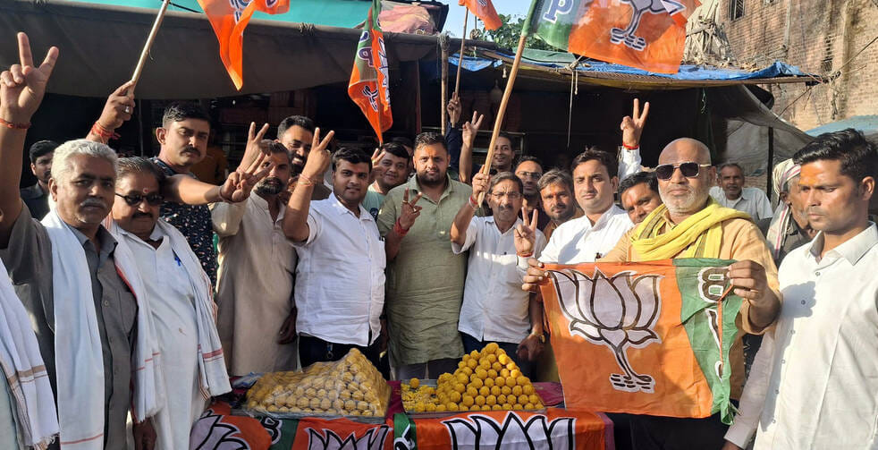 BJP celebrates victory in Bengal, Assam and Puducherry; drums played, party workers burst firecrackers, and sweets distributed to the people.