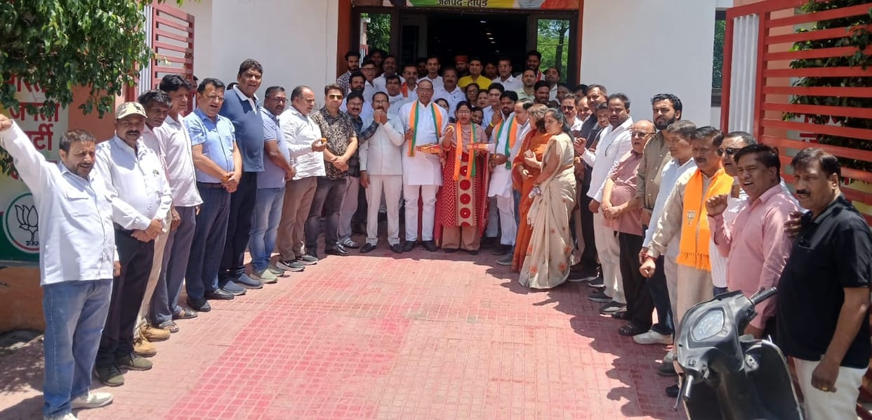 Excited BJP workers distributed sweets after victory in Assam and West Bengal.
