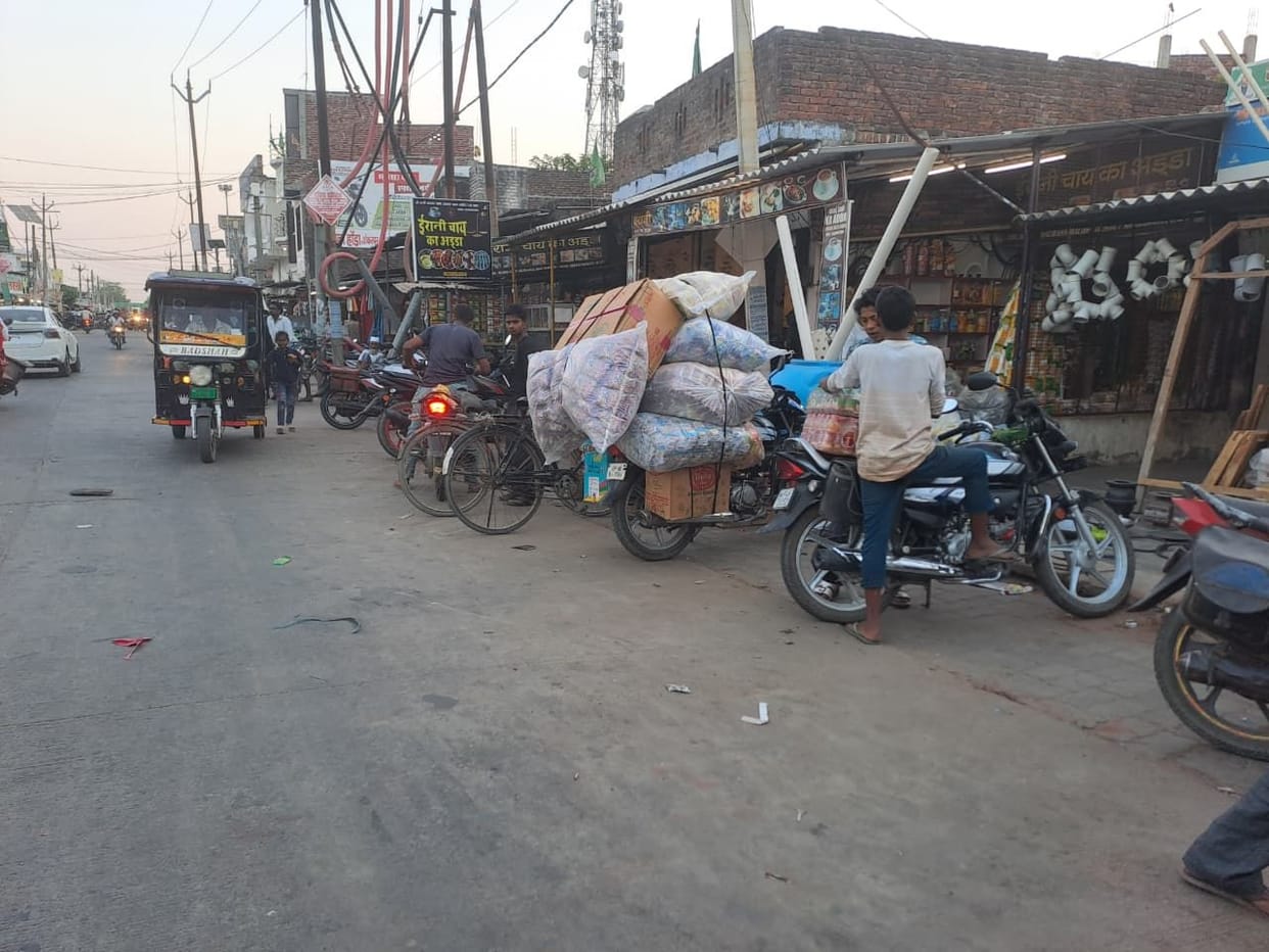 Shop goods on the tracks, vehicles parked on the road