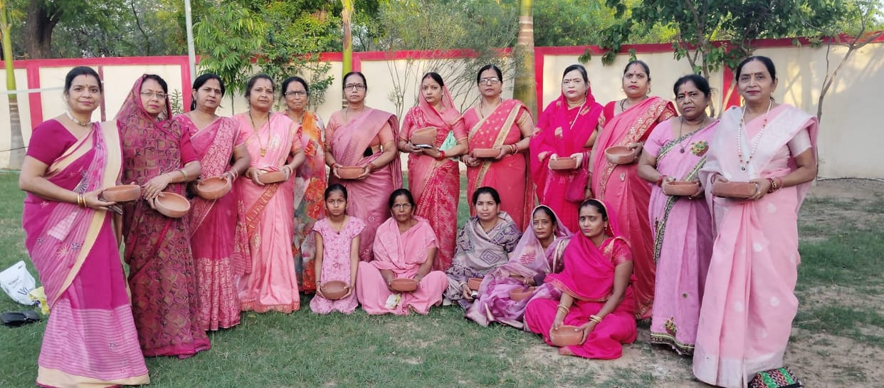 The women's group distributed water containers for birds.