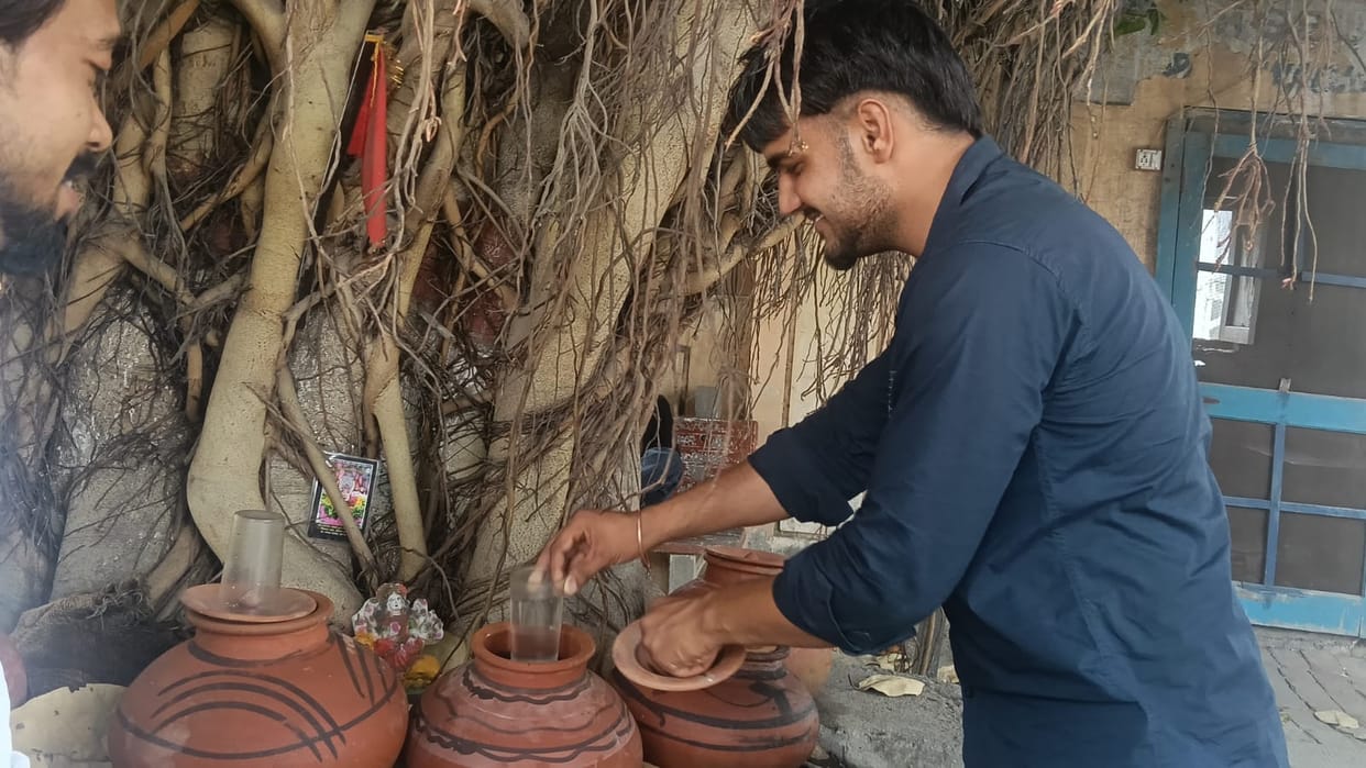 There is no drinking water facility in public places, people are buying water to drink.