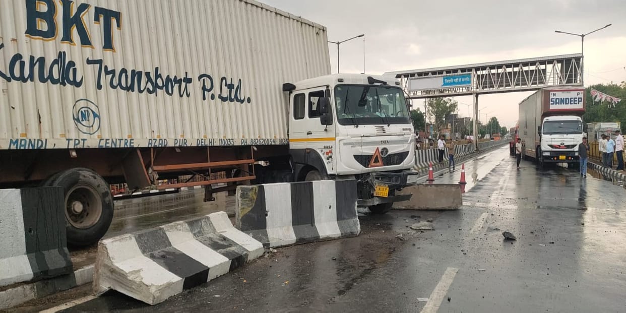 Container breaks divider and rams into school bus, student injured