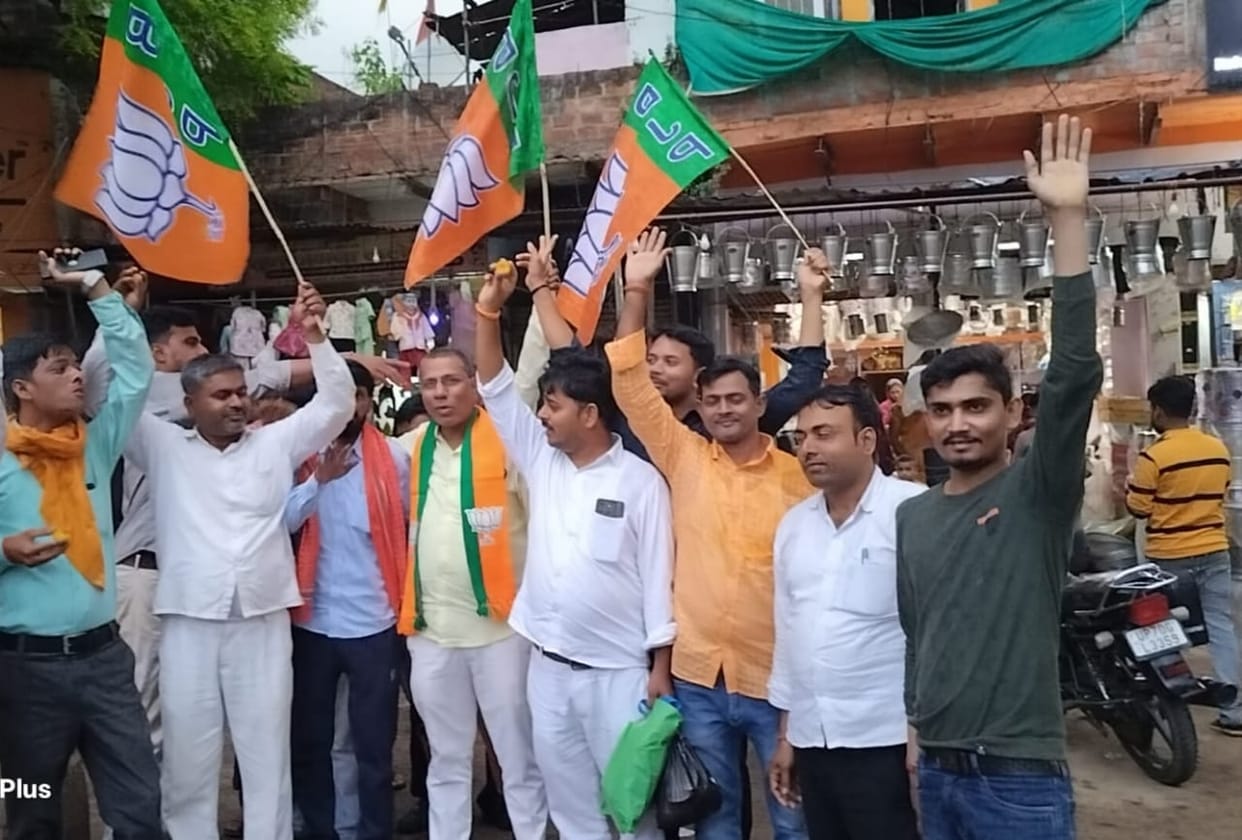 Celebrations over BJP's victory in three states; party workers distribute sweets.