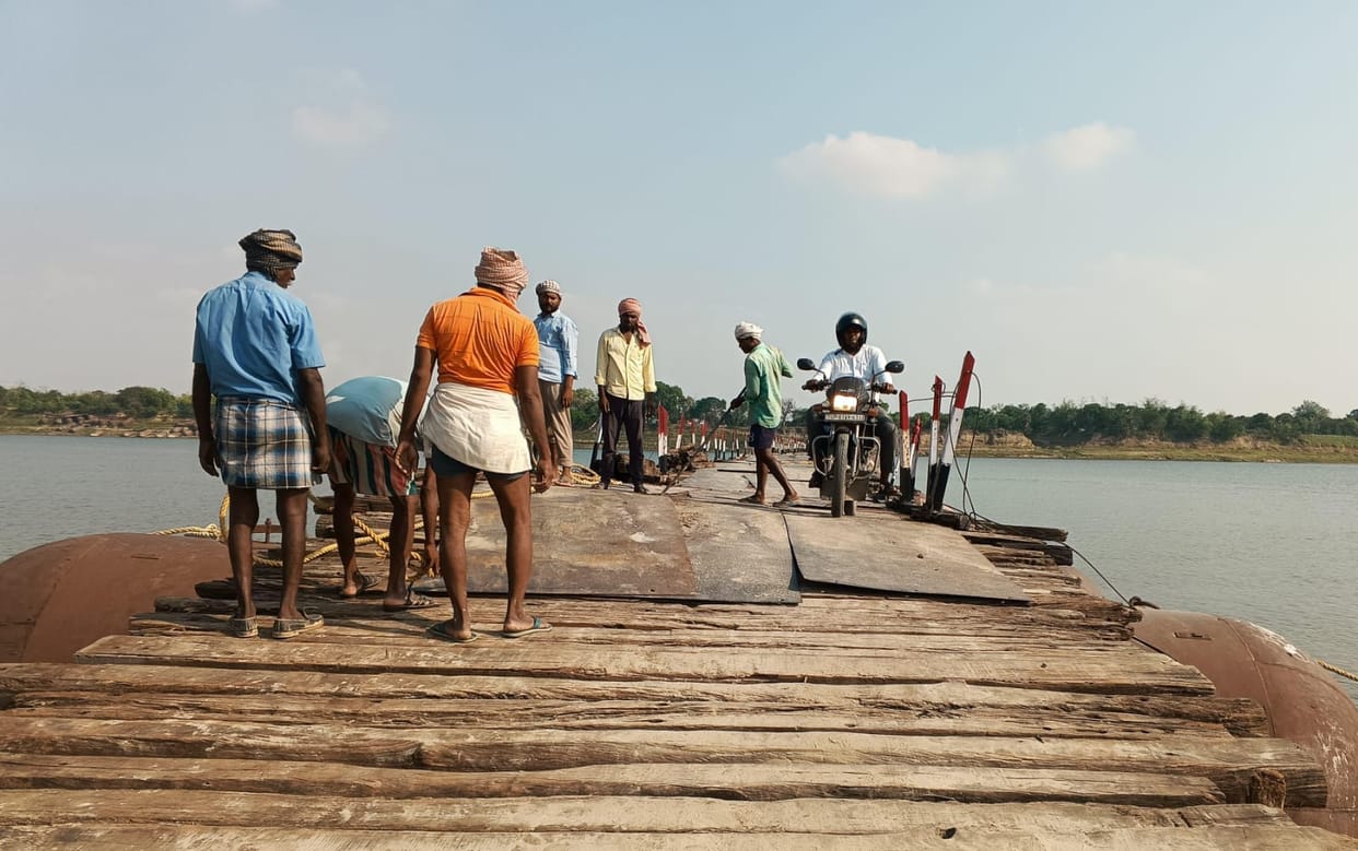 A rider on a motorcycle crossing the Firozpur-Bara pontoon bridge